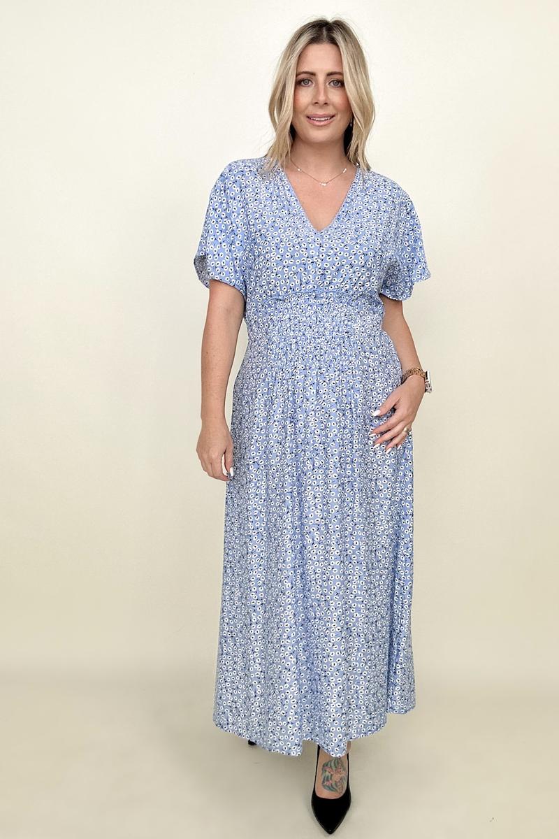 Calf-length blue animal print dress with short dolman sleeves and V-neck.