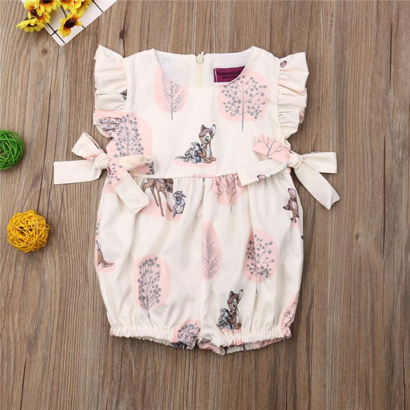 Pink sleeveless cotton romper for baby sleepwear with animal print, bow accents, and ruffled edges.