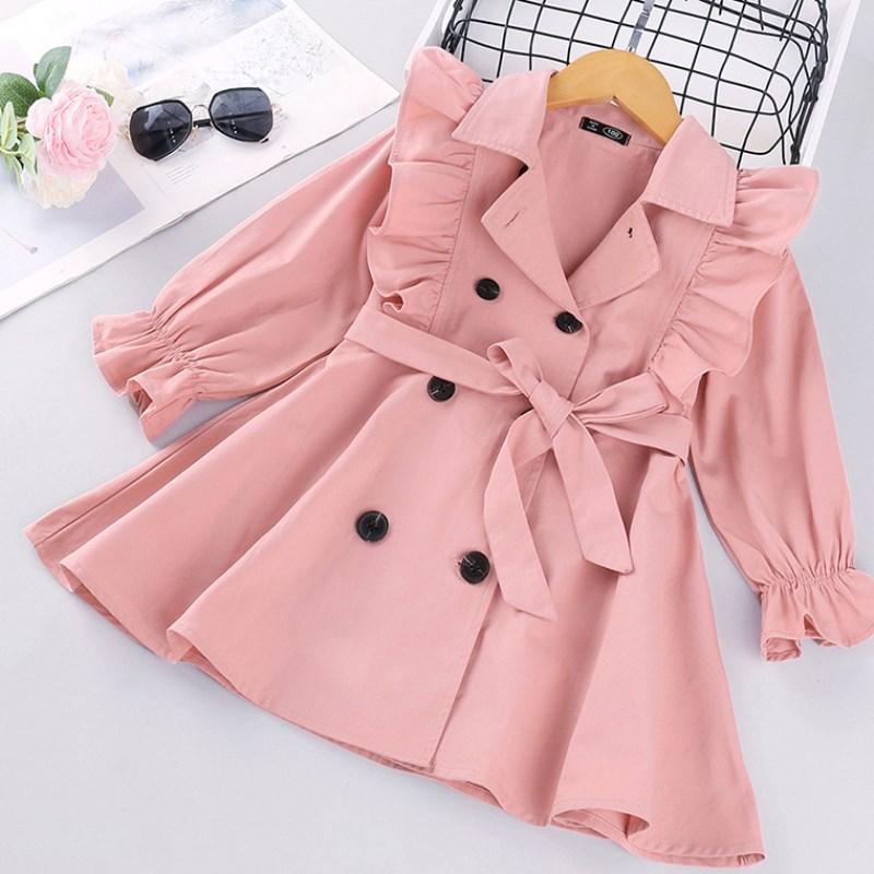 Girls' pink trench coat with double-breasted design and tie belt on display.