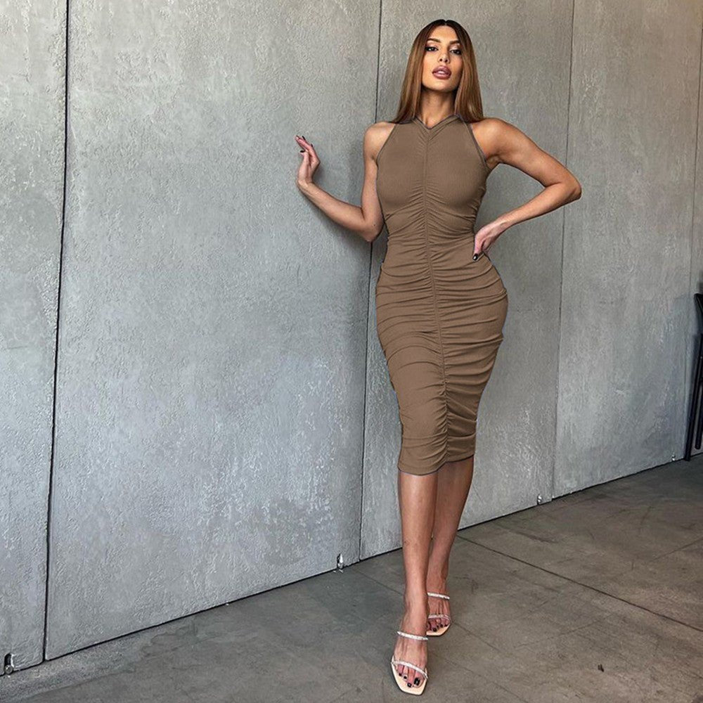 Knitted pleated sleeveless dress in brown, showcasing feminine elegance and modern style.