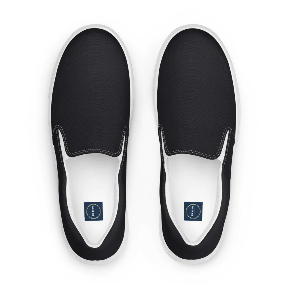 Men's black and white slip-on canvas shoes with elastic sides and cushioned sole