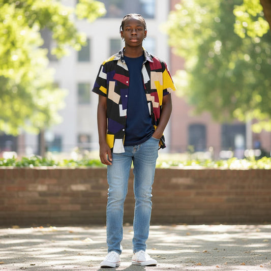 GIGI & POPO men's short sleeve shirt with a geometric print in black, yellow, and red, worn over a navy t-shirt.