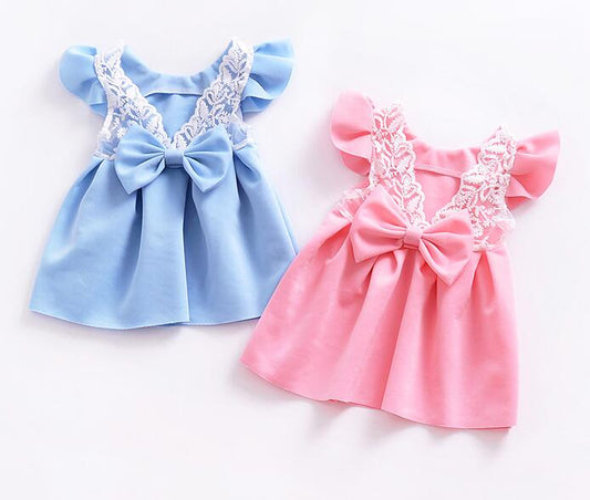 Blue and pink cotton baby dresses with lace details and bows.