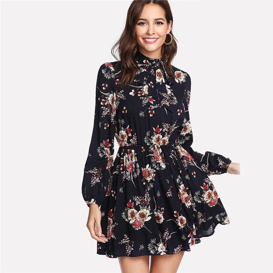 Lace-up long-sleeved floral print dress with elastic waist.