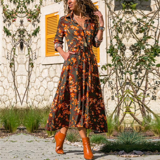 Madrid Vintage Chiffon Dress with floral print, V-neck, and high waist design in a garden setting.