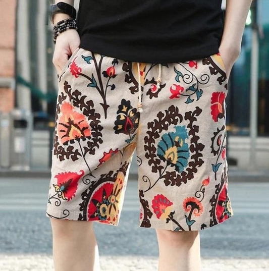 Men's linen beach shorts with colorful print design.