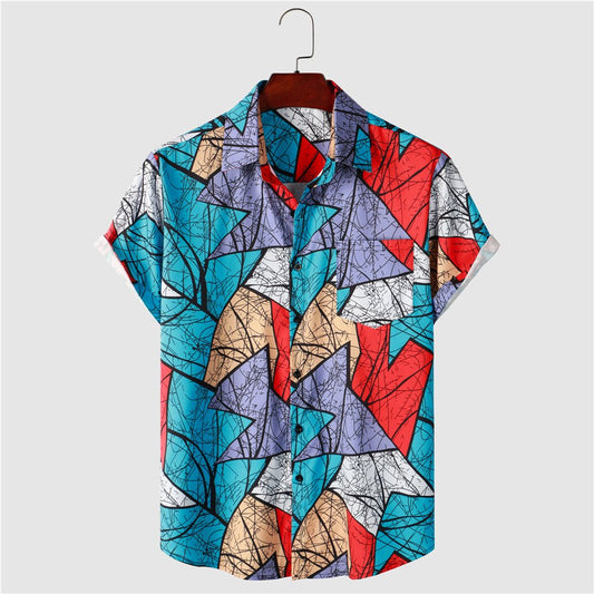 Men's T-shirt with geometric pattern print in blue, red, and beige colors, hanging on a hanger.
